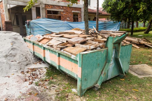 Professionals conducting loft clearance in an Ilford home